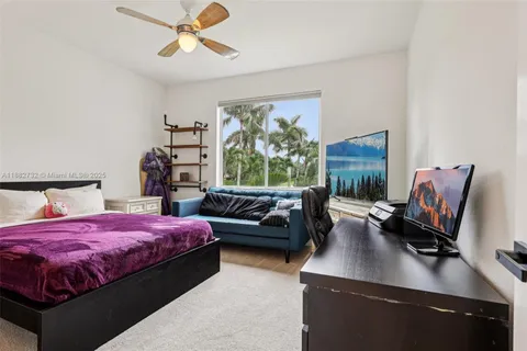 a spacious bathroom with a granite countertop sink a mirror and a shower