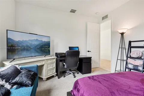 a bathroom with a tub and large window