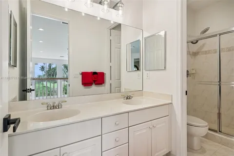 a view of a lake with houses in the back