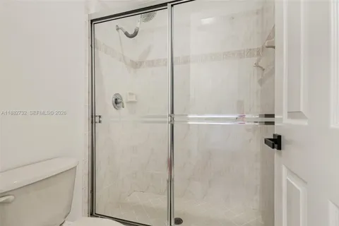 a view of building with river in front of it