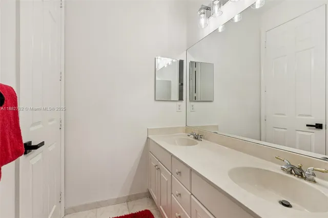 a living room filled with furniture and a floor to ceiling window