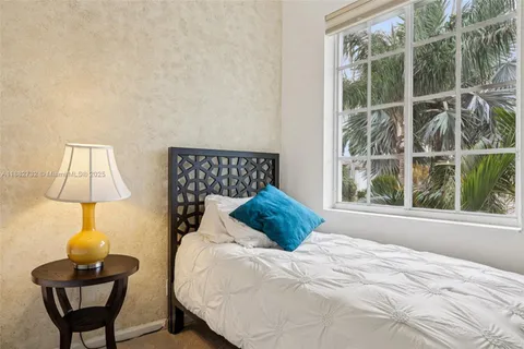 a view of building with river in front of it