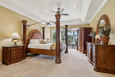 a living room with furniture kitchen and a large window