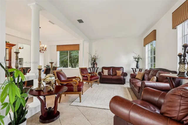 a living room with furniture and a rug