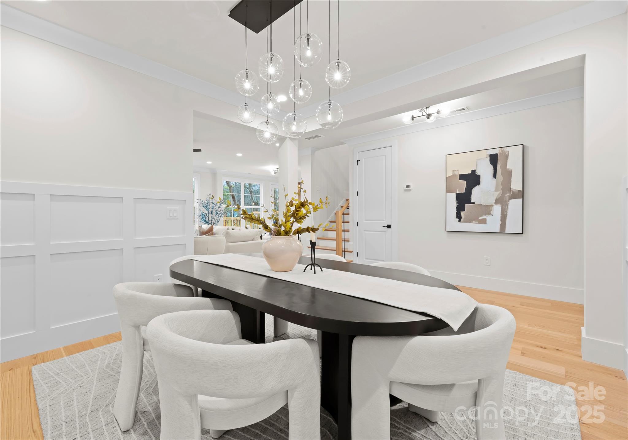 1641 Longfellow Street Charlotte, NC 28205 - Photo 11 of 48 a view of a dining room with furniture and chandelier