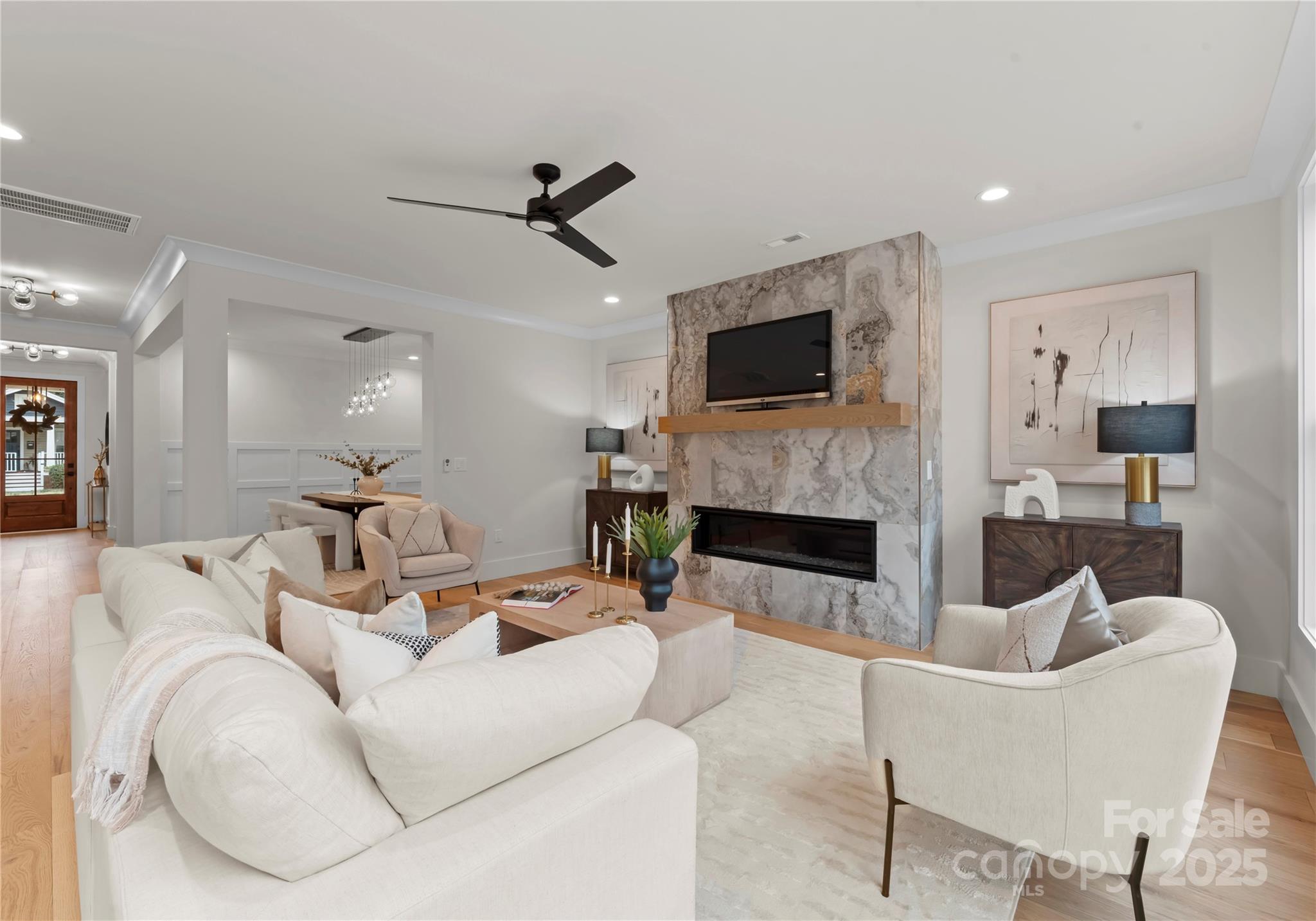 1641 Longfellow Street Charlotte, NC 28205 - Photo 15 of 48 a living room with furniture a fireplace and a flat screen tv