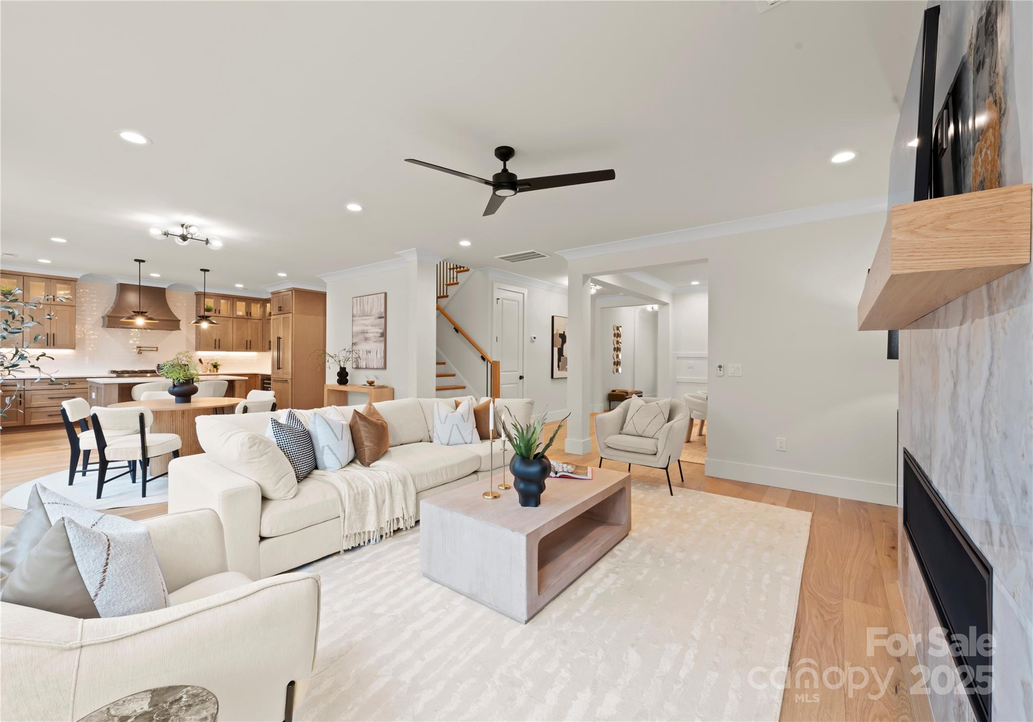 1641 Longfellow Street Charlotte, NC 28205 - Photo 16 of 48 a living room with furniture and a view of kitchen