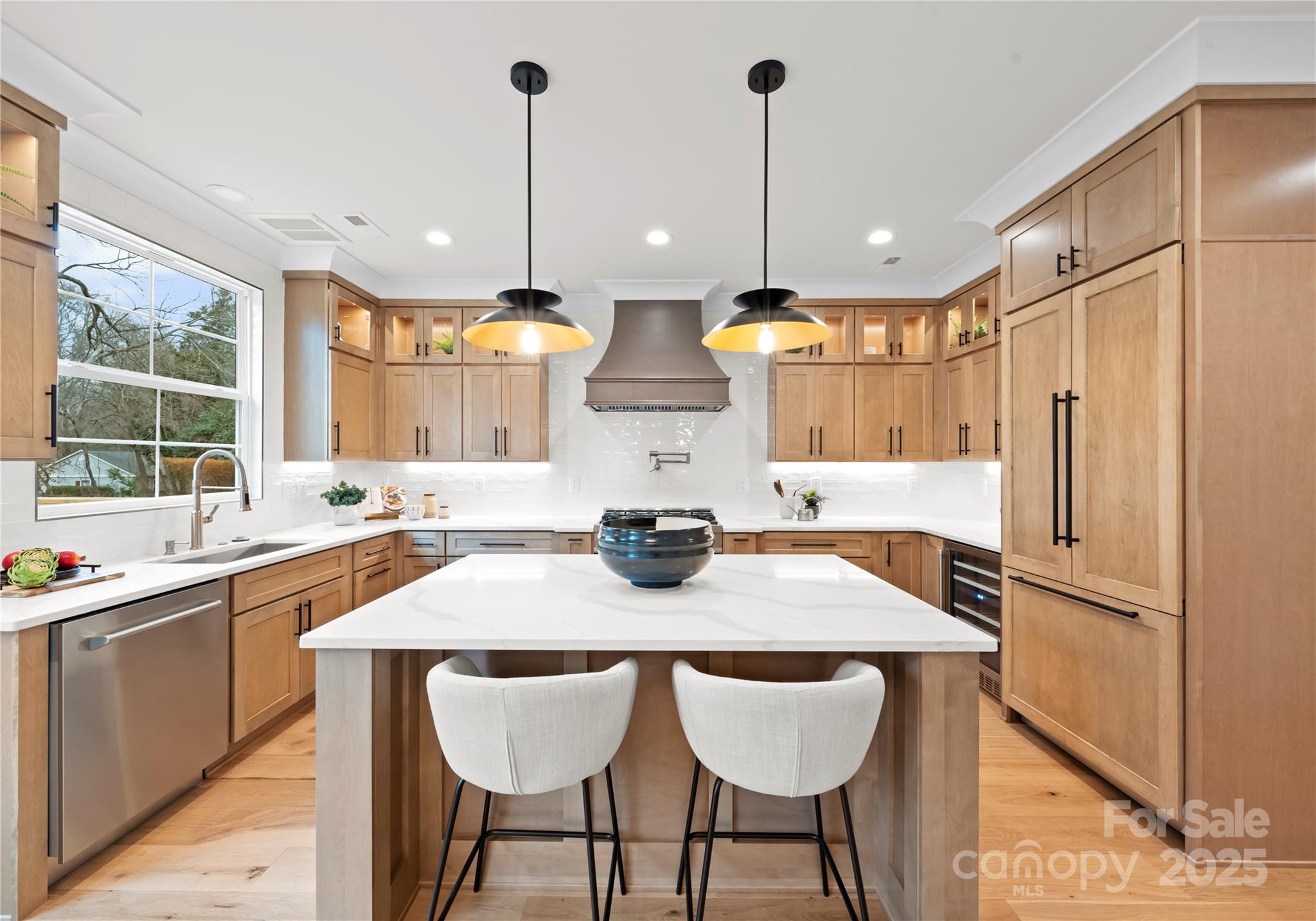1641 Longfellow Street Charlotte, NC 28205 - Photo 20 of 48 a kitchen with stainless steel appliances granite countertop a sink a stove and chairs