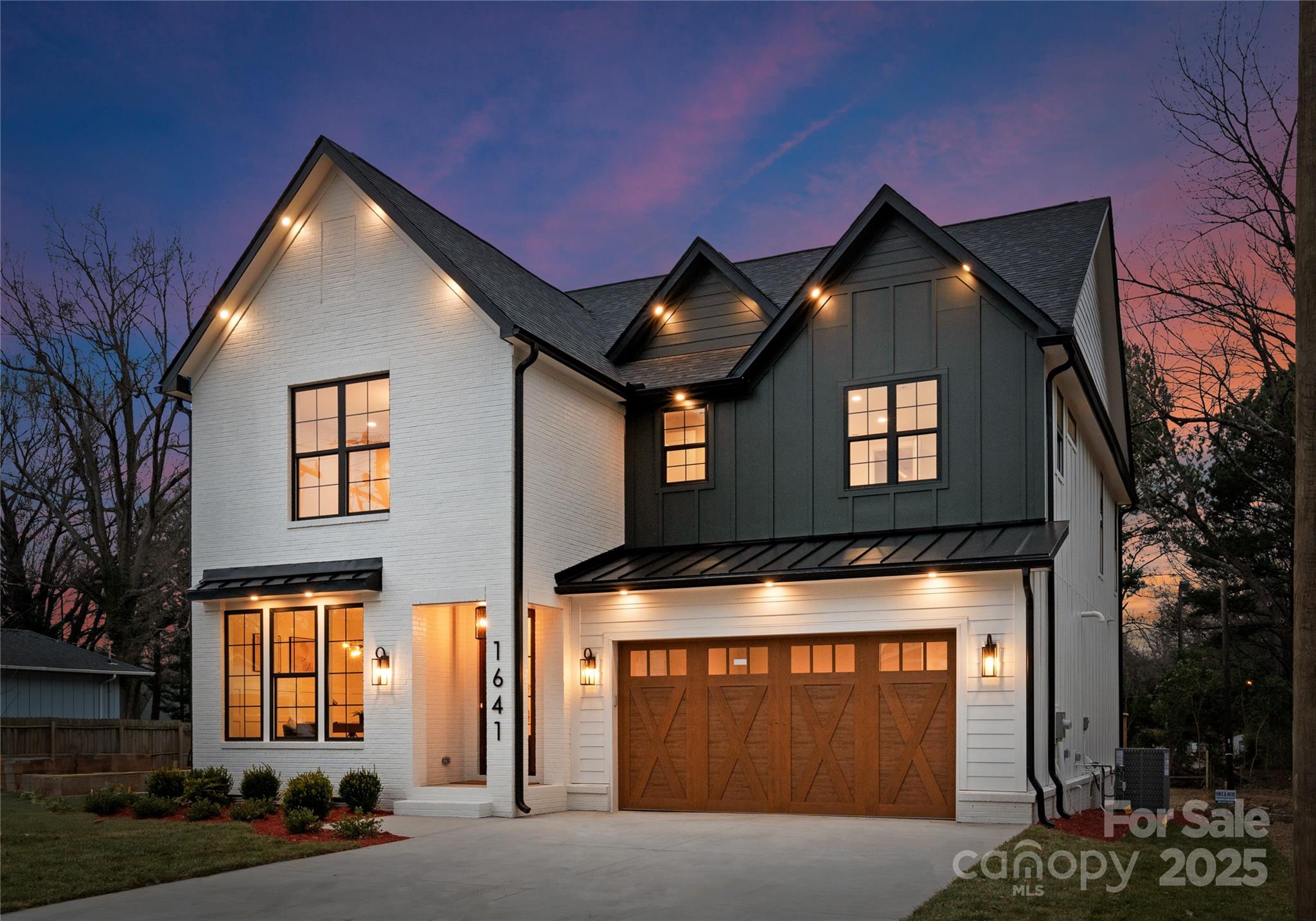 1641 Longfellow Street Charlotte, NC 28205 - Photo 2 of 48 a front view of a house with a yard
