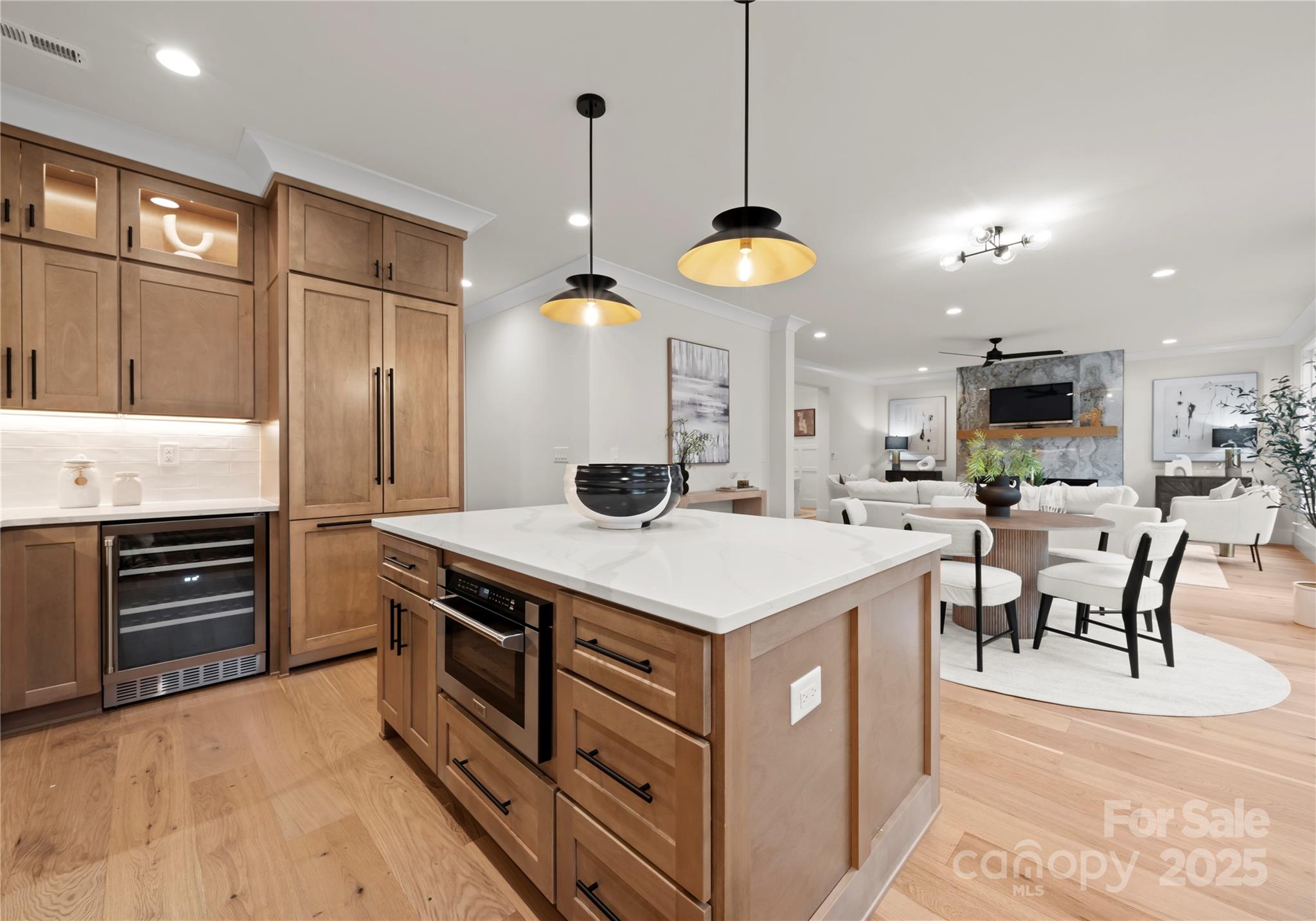 1641 Longfellow Street Charlotte, NC 28205 - Photo 24 of 48 a kitchen with a stove a chandelier and a refrigerator