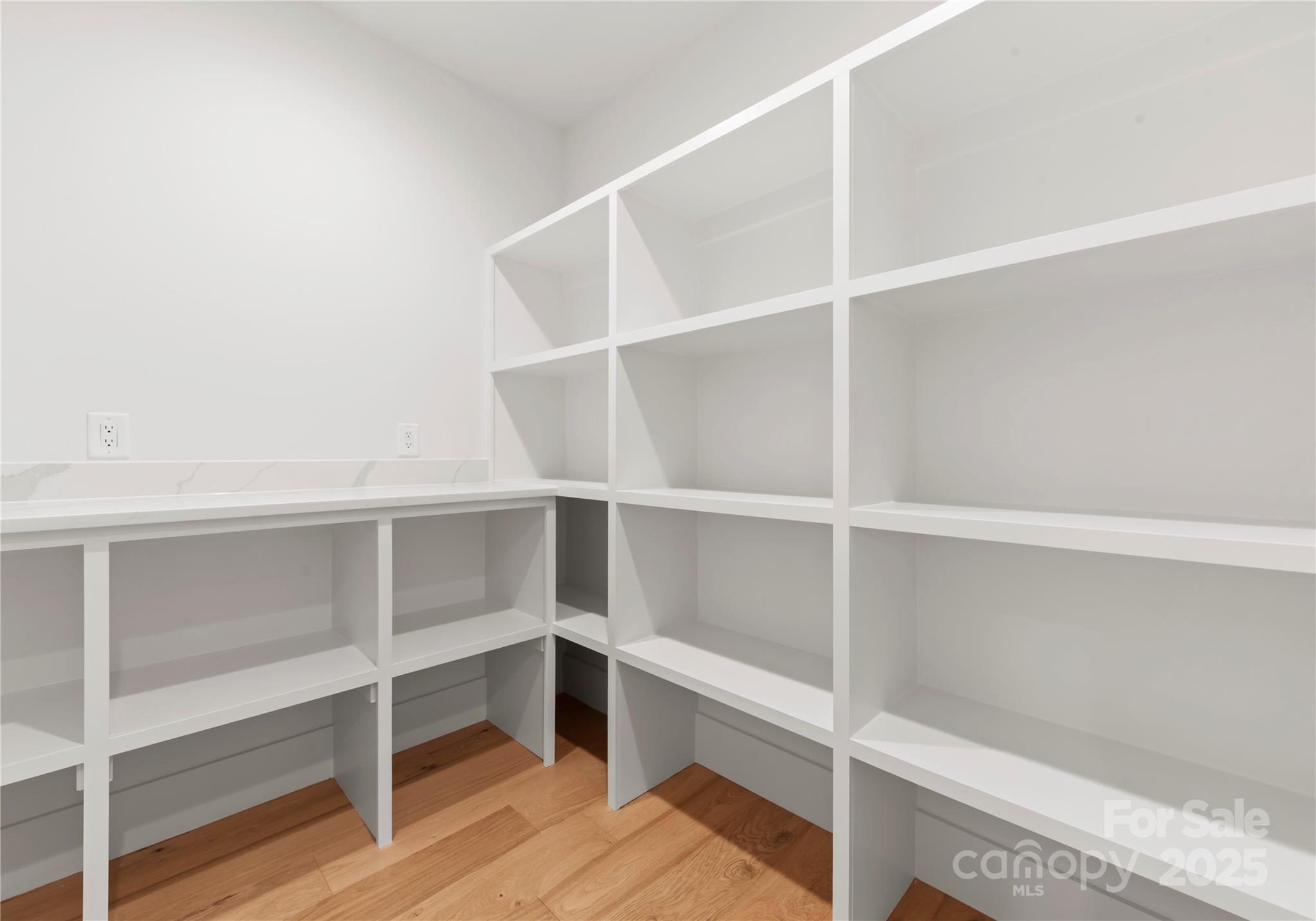 1641 Longfellow Street Charlotte, NC 28205 - Photo 26 of 48 a view of walk in closet with empty racks