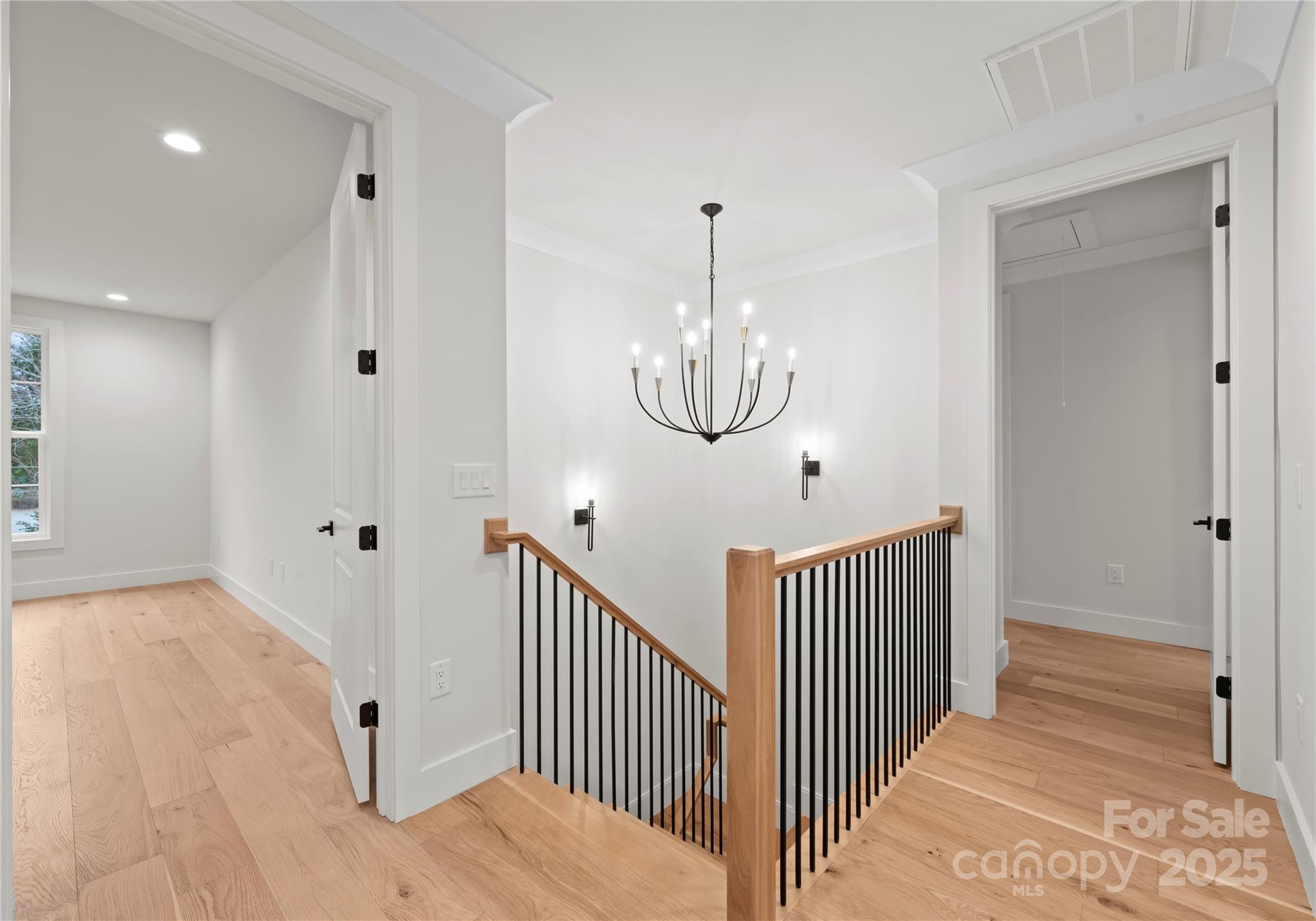 1641 Longfellow Street Charlotte, NC 28205 - Photo 27 of 48 a view of a hallway with wooden floor and stairs