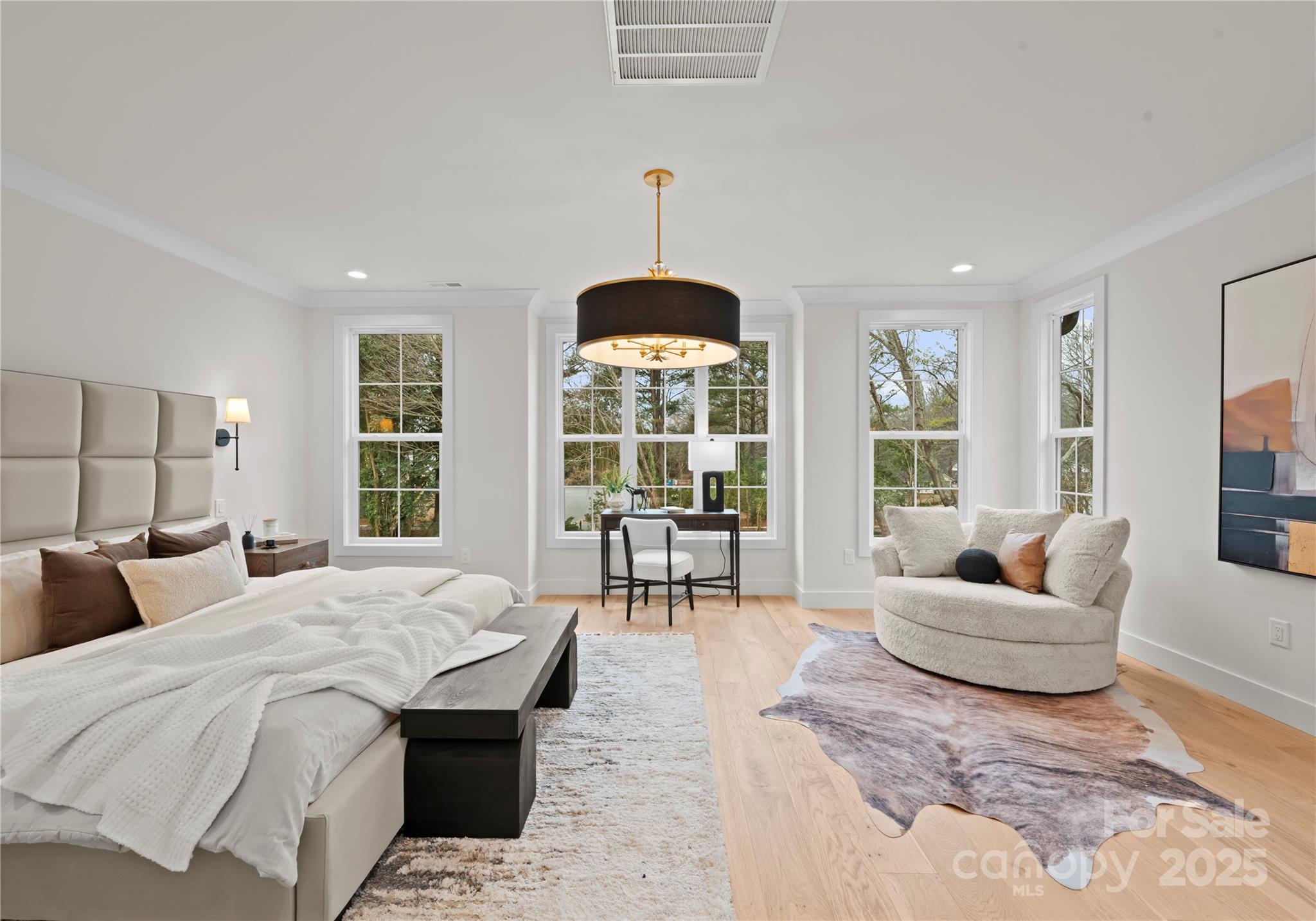 1641 Longfellow Street Charlotte, NC 28205 - Photo 28 of 48 a living room with furniture and a chandelier