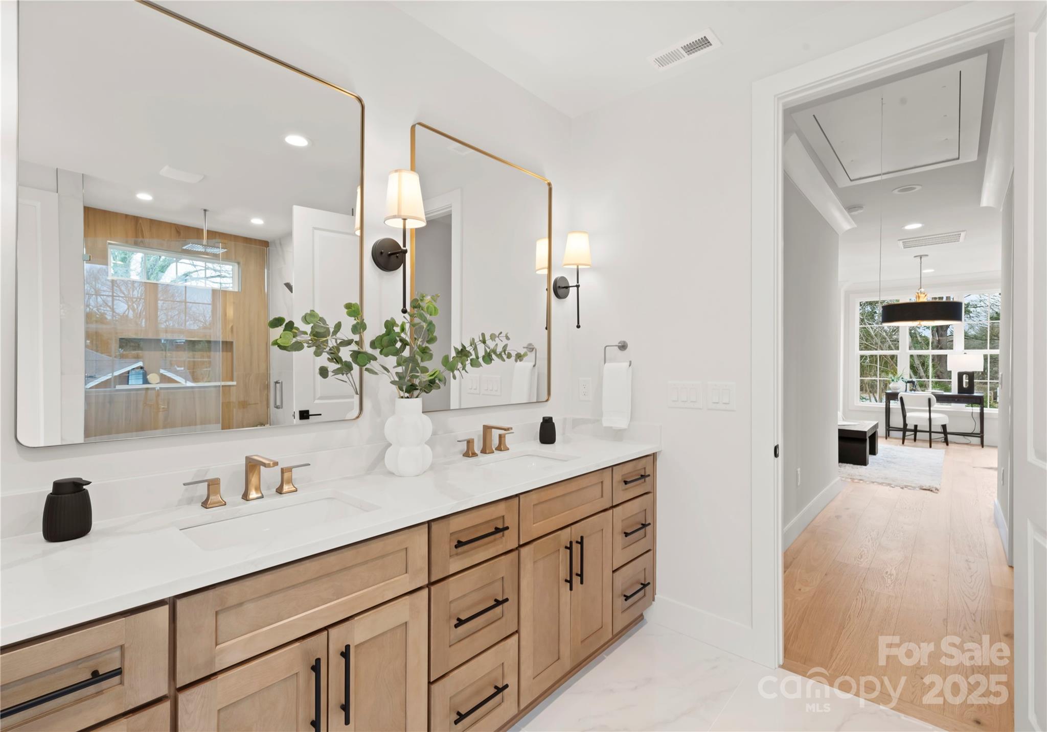 1641 Longfellow Street Charlotte, NC 28205 - Photo 32 of 48 a spacious bathroom with a double vanity sink mirror and shower