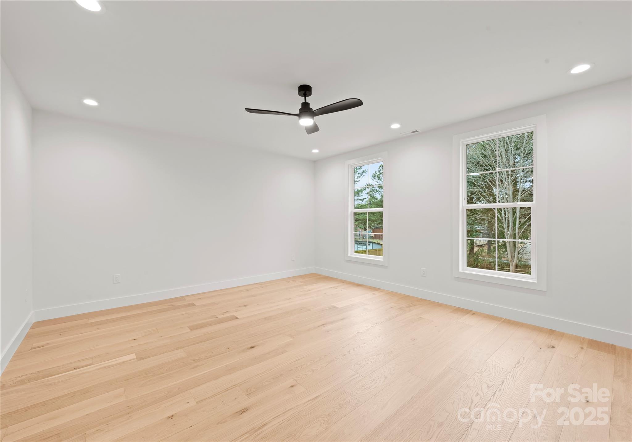 1641 Longfellow Street Charlotte, NC 28205 - Photo 37 of 48 wooden floor in an empty room with a window