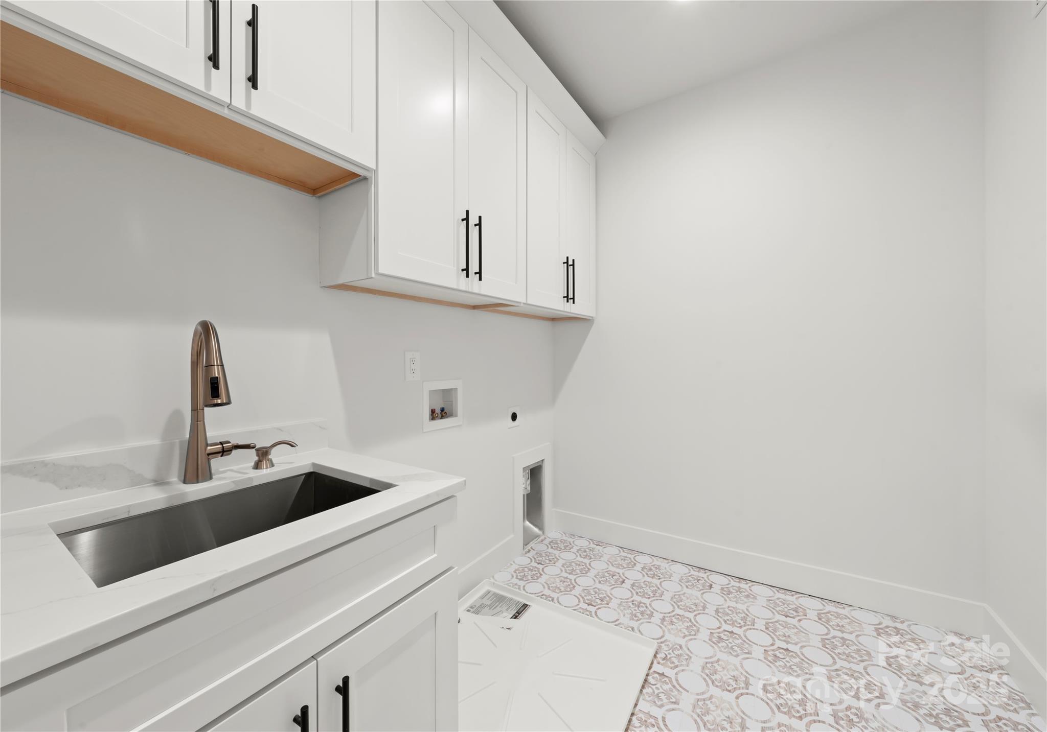 1641 Longfellow Street Charlotte, NC 28205 - Photo 42 of 48 a kitchen with a sink and cabinets