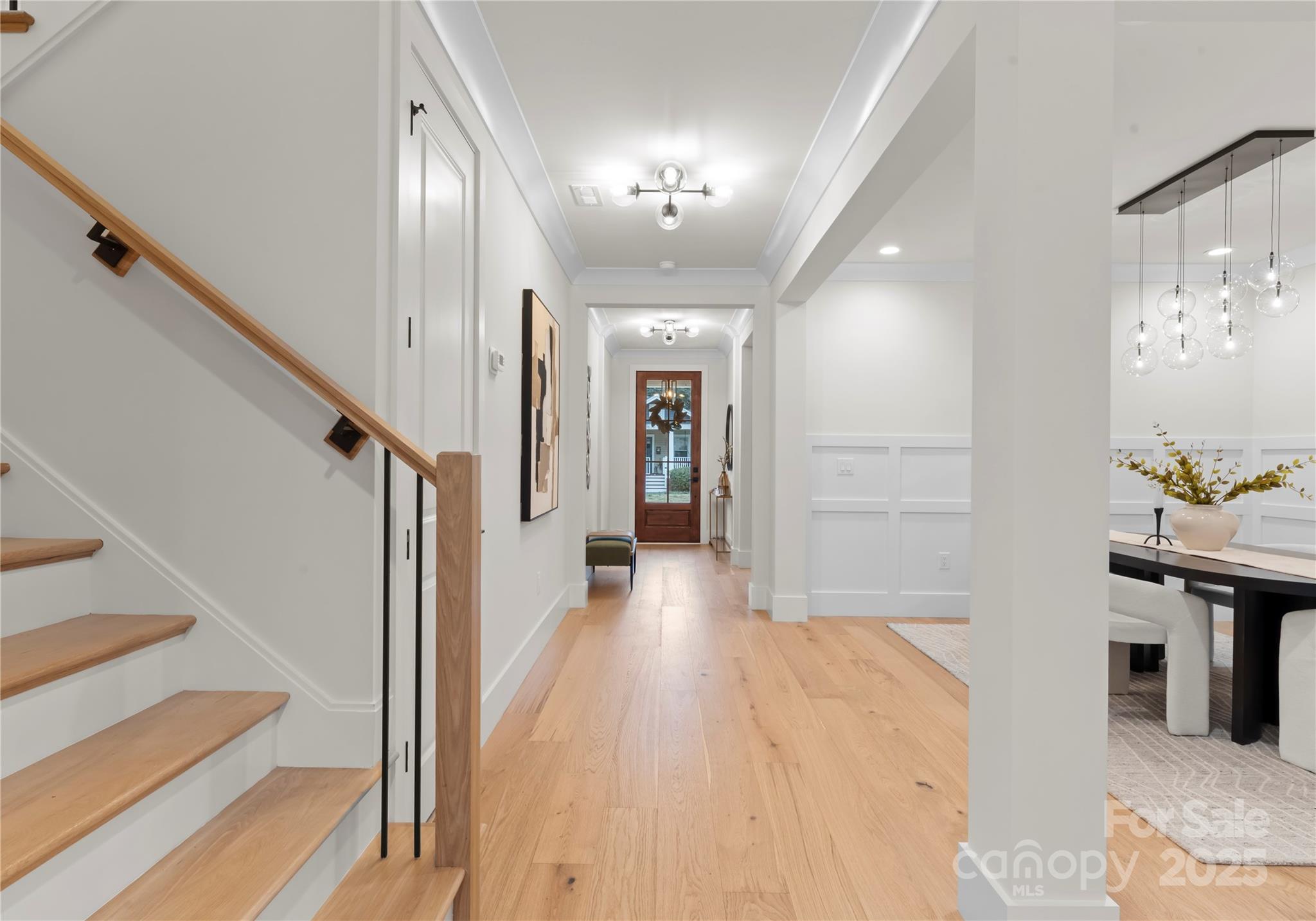 1641 Longfellow Street Charlotte, NC 28205 - Photo 7 of 48 a view of a hallway with wooden floor and staircase