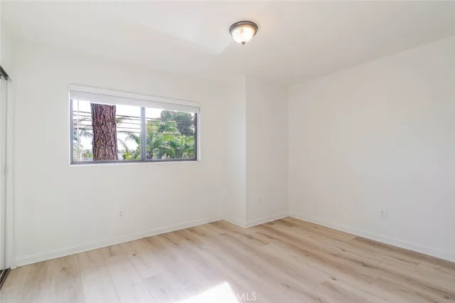 a bathroom with a granite countertop sink and mirror