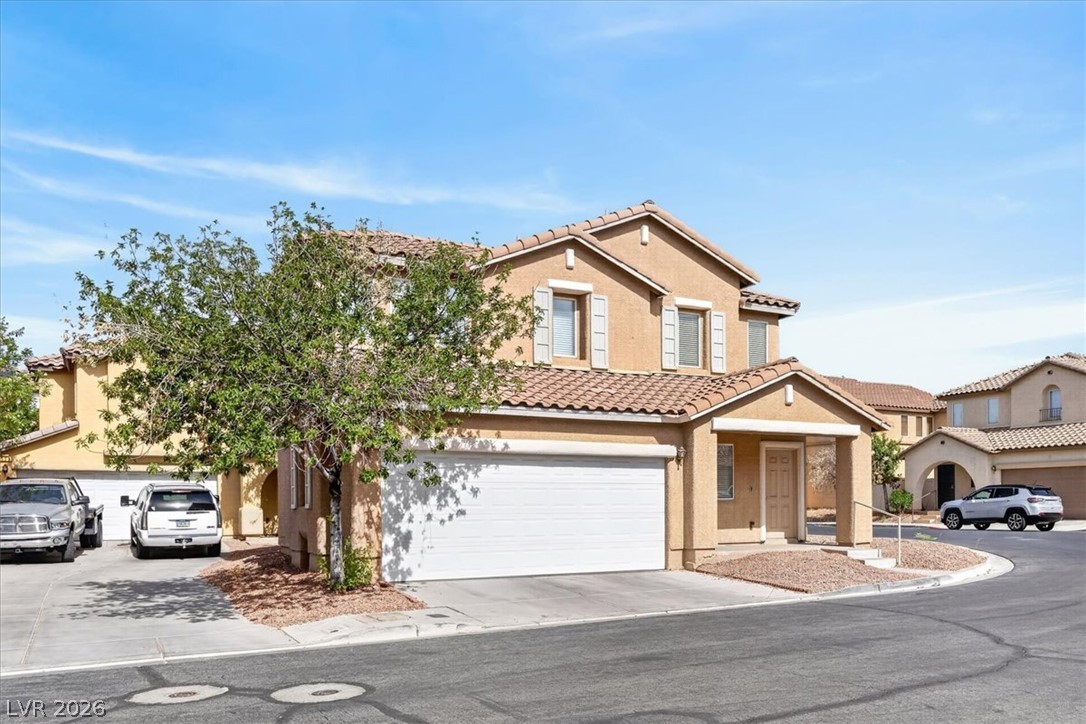 552 Albacate Street Henderson, NV 89015 - Photo 2 of 40 A well-maintained facade with an attached garage offers appealing curb presence.