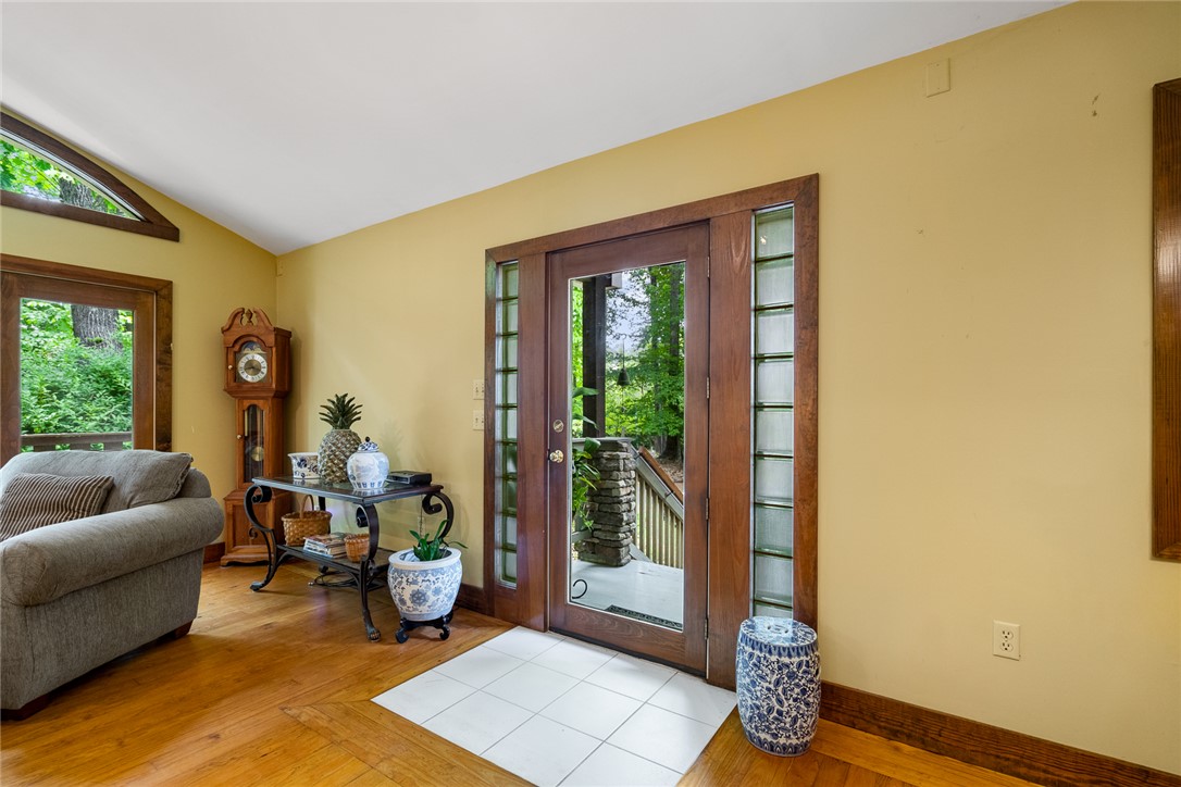324 Hobson Road Anderson, SC 29621 - Photo 6 of 46 Enter into a bright living area featuring beautiful wood flooring and expansive windows.