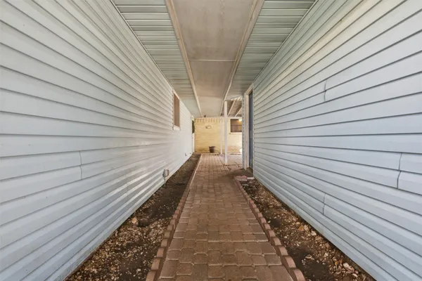 a view of a pathway with a balcony