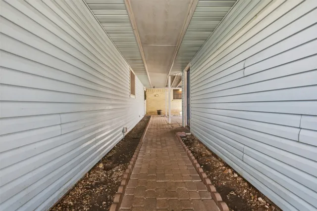 a view of a pathway with a balcony