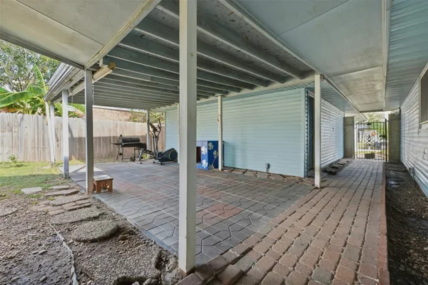 a view of a backyard of the house
