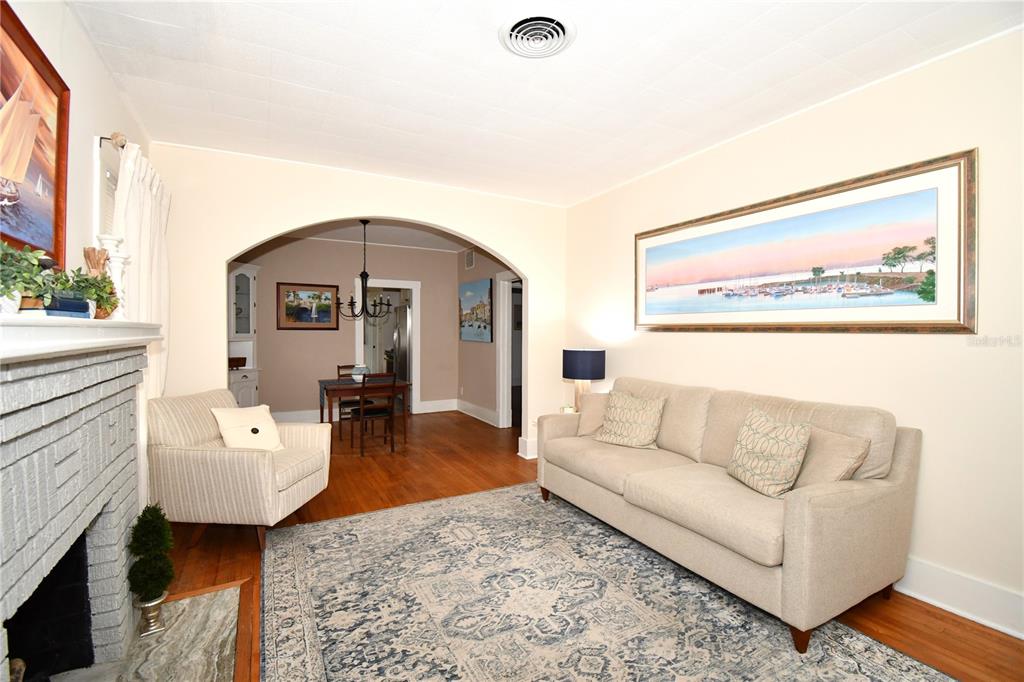 1245 Alexander Street Mount Dora, FL 32757 - Photo 11 of 55 a living room with furniture and wooden floor