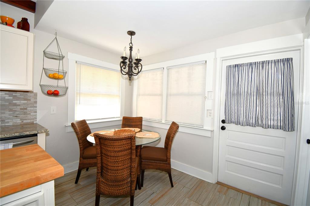 1245 Alexander Street Mount Dora, FL 32757 - Photo 19 of 55 a view of a dining room with furniture and window