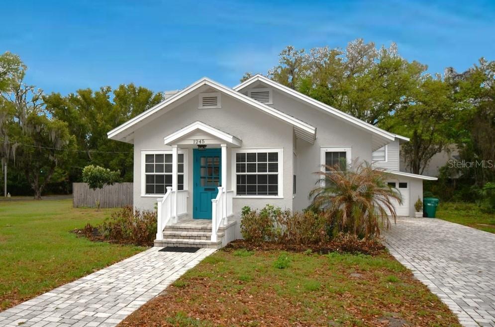 1245 Alexander Street Mount Dora, FL 32757 - Photo 2 of 55 a front view of a house with a yard