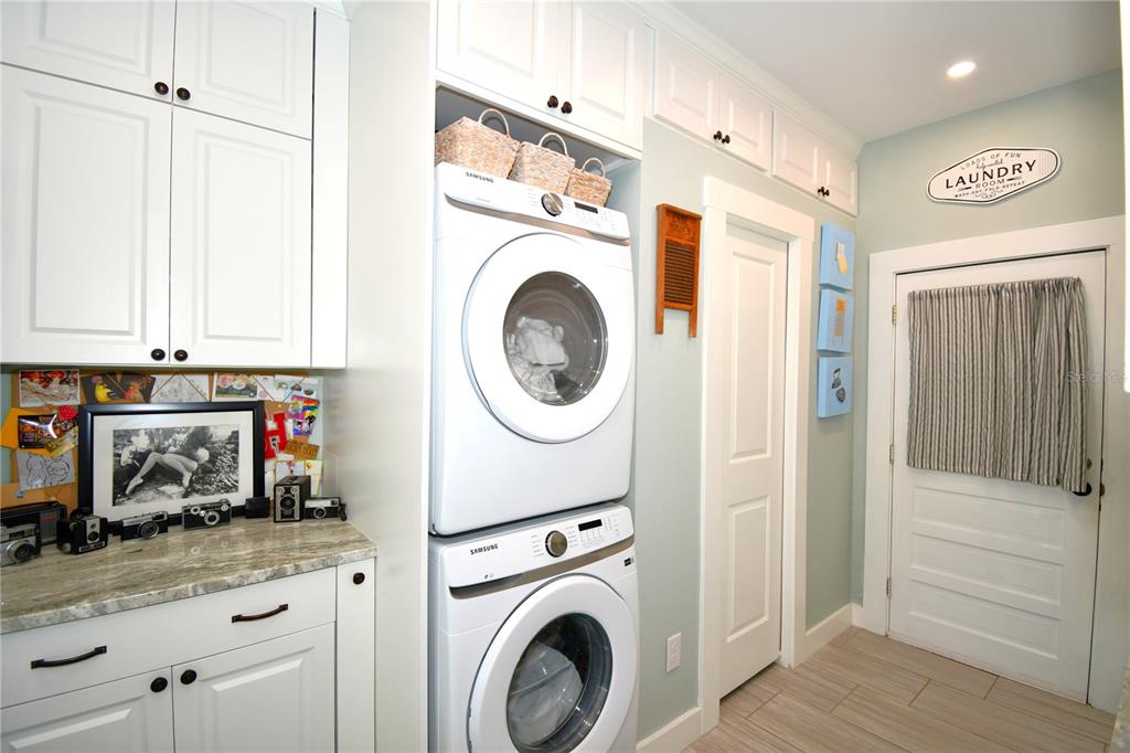 1245 Alexander Street Mount Dora, FL 32757 - Photo 22 of 55 a view of a storage and utility room with washer and dryer