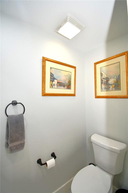 1245 Alexander Street Mount Dora, FL 32757 - Photo 24 of 55 a bathroom with a toilet and a shower