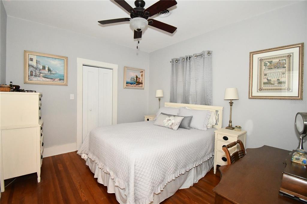 1245 Alexander Street Mount Dora, FL 32757 - Photo 25 of 55 a bedroom with a bed and wooden floor