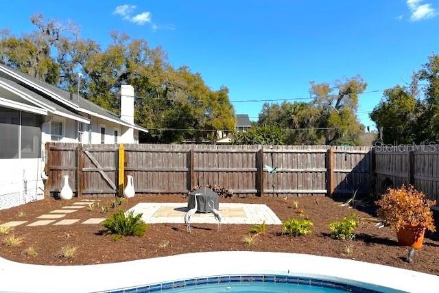 1245 Alexander Street Mount Dora, FL 32757 - Photo 33 of 55 a view of a house with backyard and trees