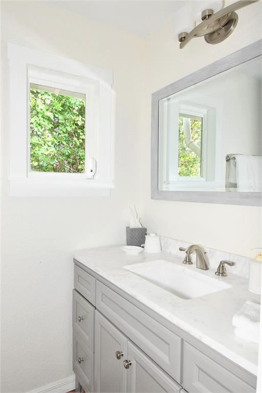 1245 Alexander Street Mount Dora, FL 32757 - Photo 46 of 55 a bathroom with a sink and a window
