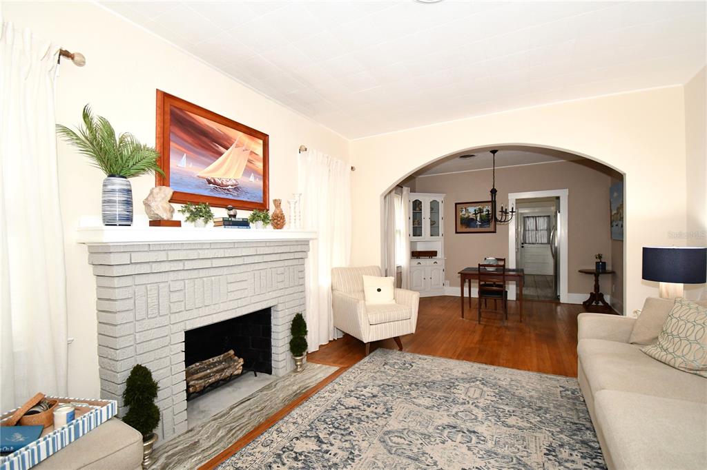 1245 Alexander Street Mount Dora, FL 32757 - Photo 9 of 55 a living room with furniture and a fireplace