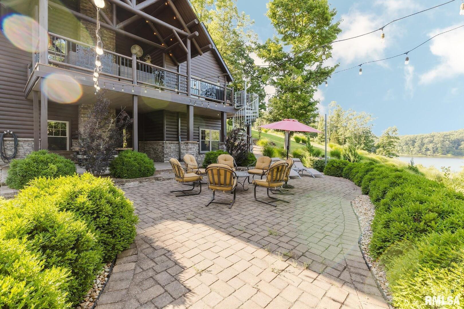 3525 Parrish Ridge Lane Goreville, IL 62939 - Photo 13 of 86 a view of a patio with table and chairs and potted plants
