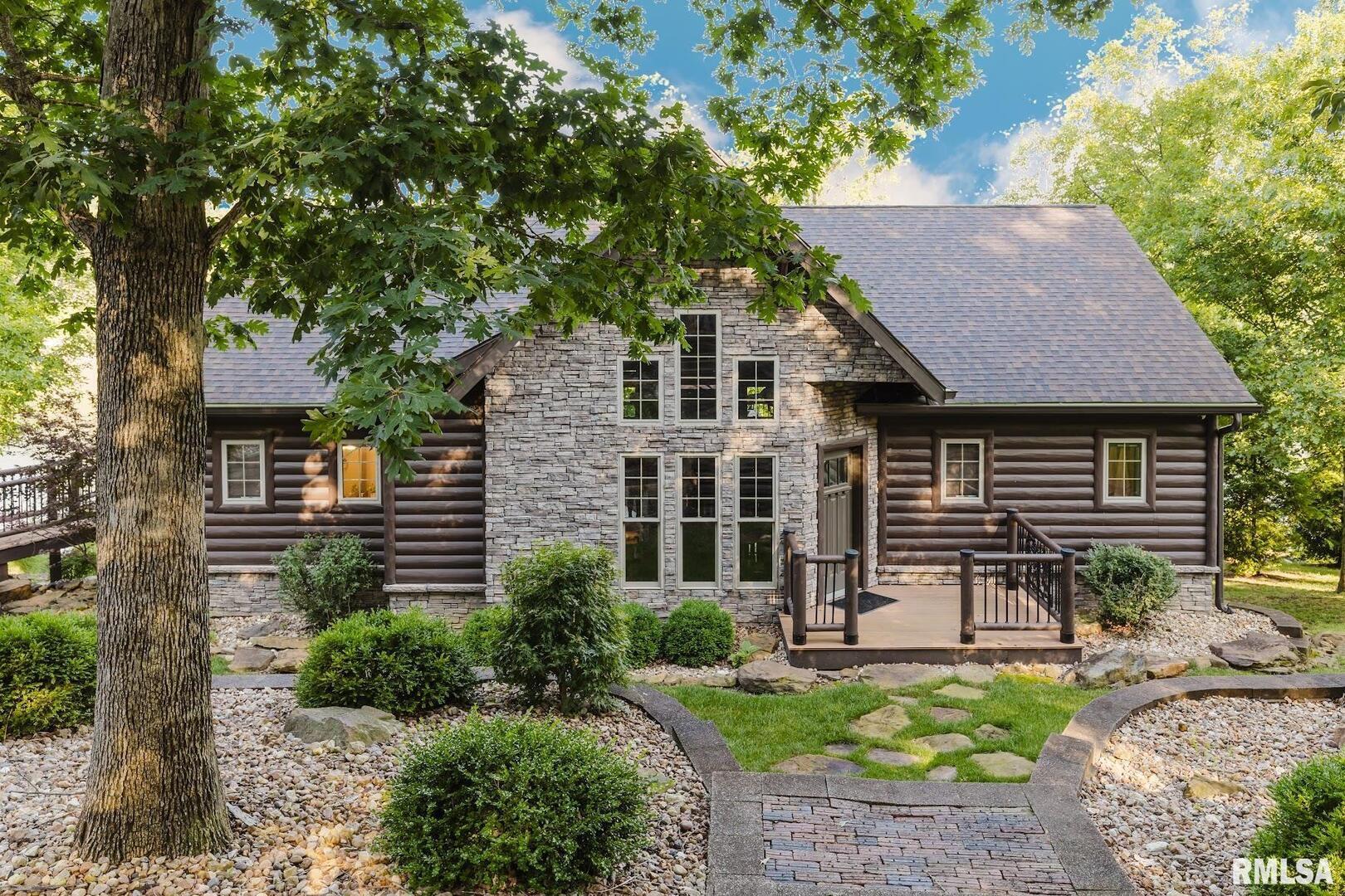 3525 Parrish Ridge Lane Goreville, IL 62939 - Photo 2 of 86 a front view of a house with garden