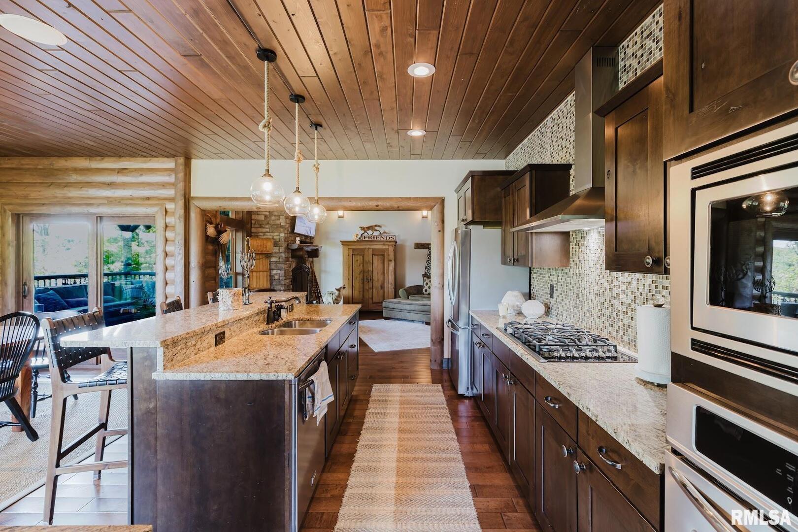3525 Parrish Ridge Lane Goreville, IL 62939 - Photo 37 of 86 a large kitchen with kitchen island a sink counter space and stainless steel appliances