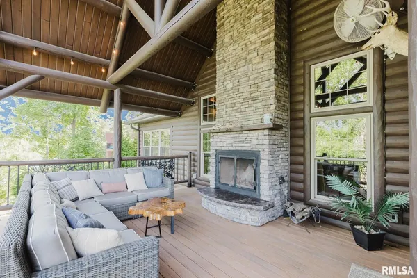 a view of a patio with chairs and a fire pit