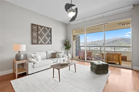 a living room with furniture and a large window
