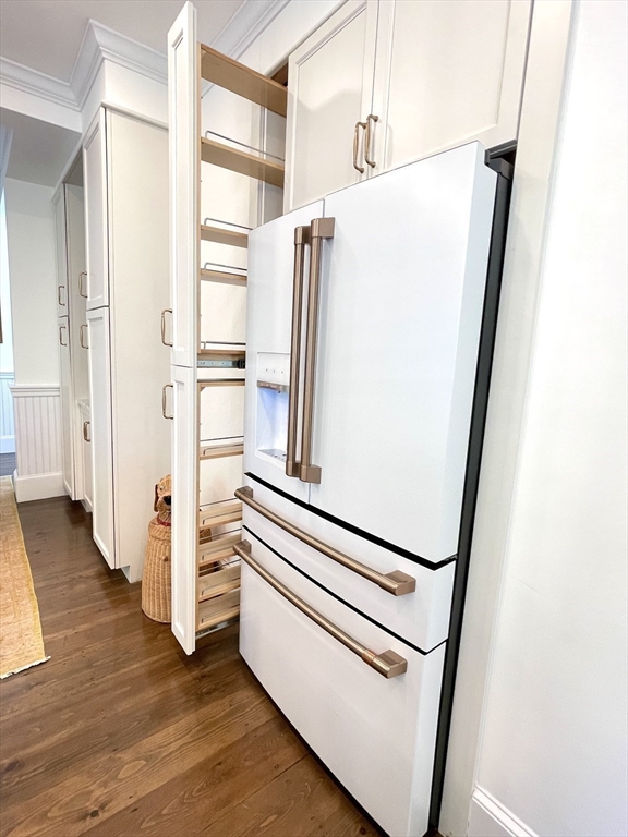 247 Main Street Groton, MA 01450 - Photo 11 of 42 a view of a kitchen with wooden floor and electronic appliances