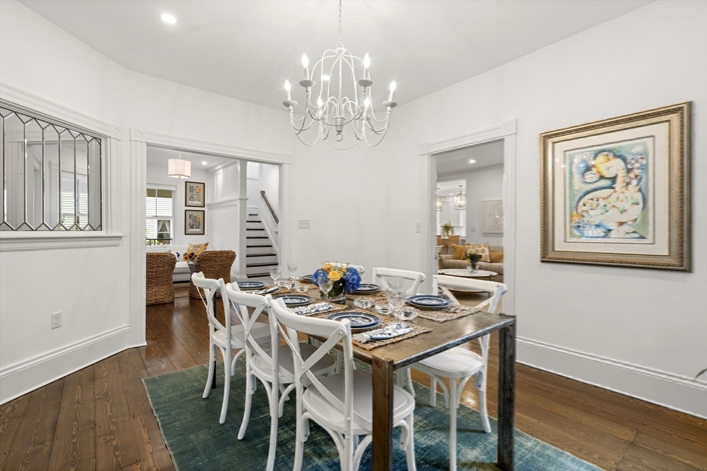 247 Main Street Groton, MA 01450 - Photo 18 of 42 a view of a dining room with furniture wooden floor and chandelier