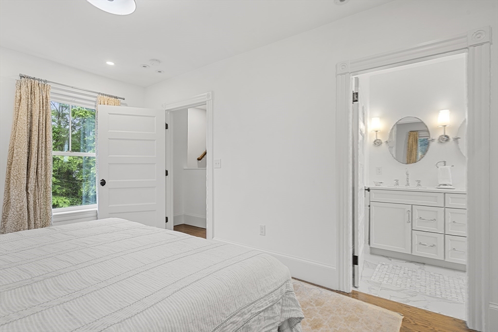 247 Main Street Groton, MA 01450 - Photo 26 of 42 a bathroom with a sink a light fixture and a mirror