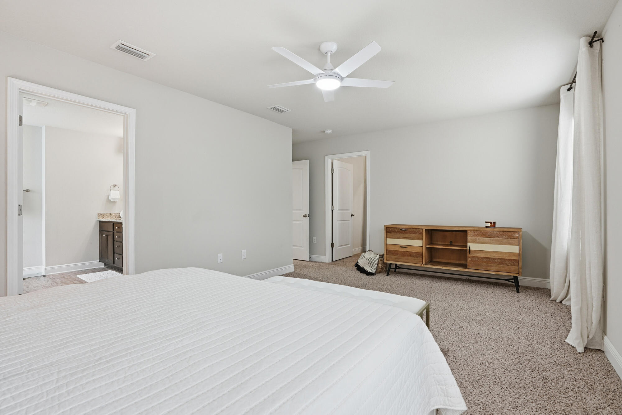 88 Marsh Landing South Freeport, FL 32439 - Photo 28 of 48 a bedroom with a bed and a chandelier