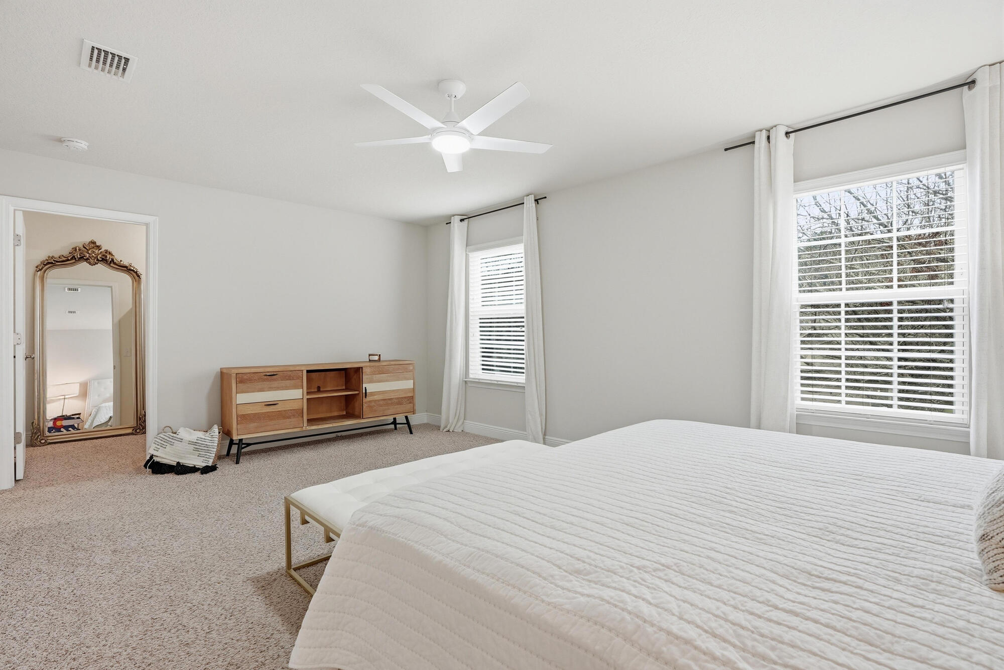 88 Marsh Landing South Freeport, FL 32439 - Photo 32 of 48 a bedroom with a bed a mirror and a large window