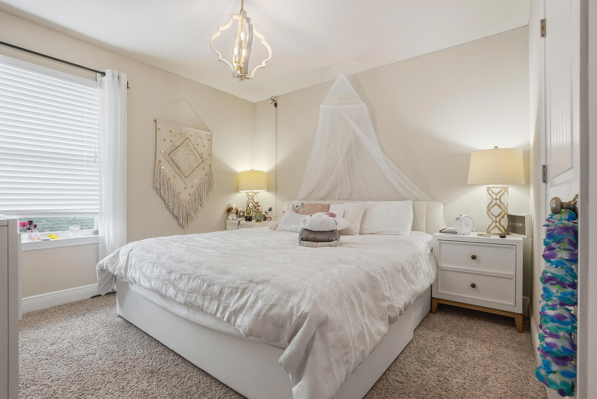 88 Marsh Landing South Freeport, FL 32439 - Photo 36 of 48 a bedroom with a bed and a chandelier