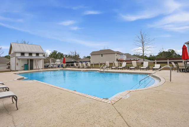 a view of a swimming pool with a chairs