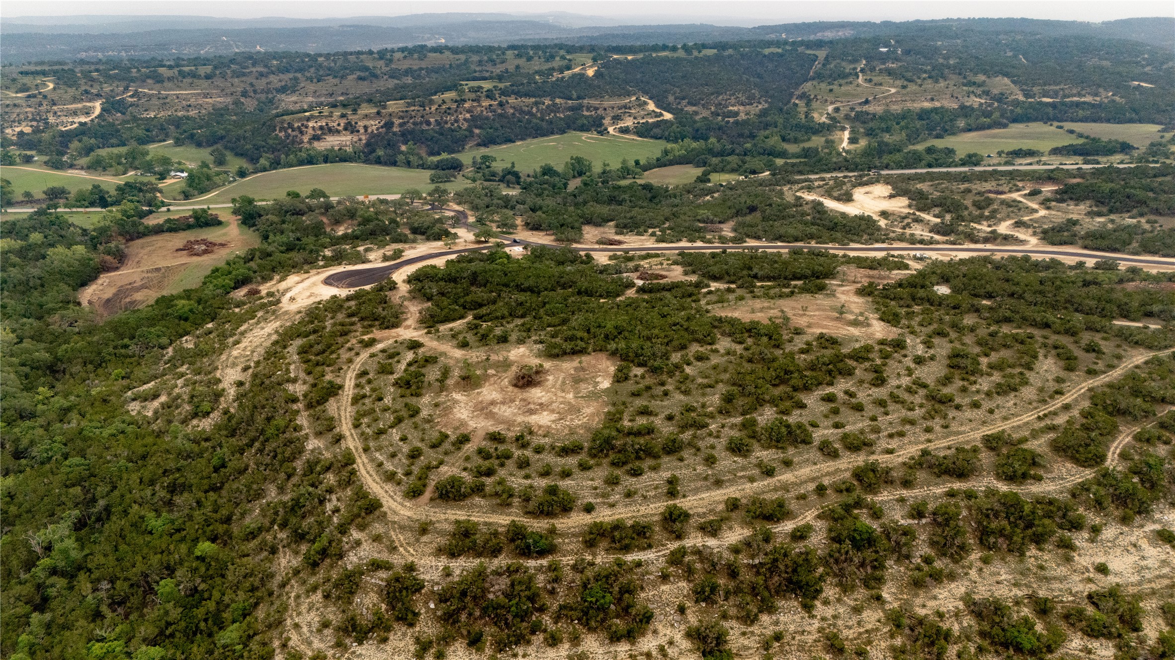 Lot 22 Ranch Road 165 Dripping Springs, TX 78620 - Photo 4 of 11 an aerial view of residential houses with outdoor space