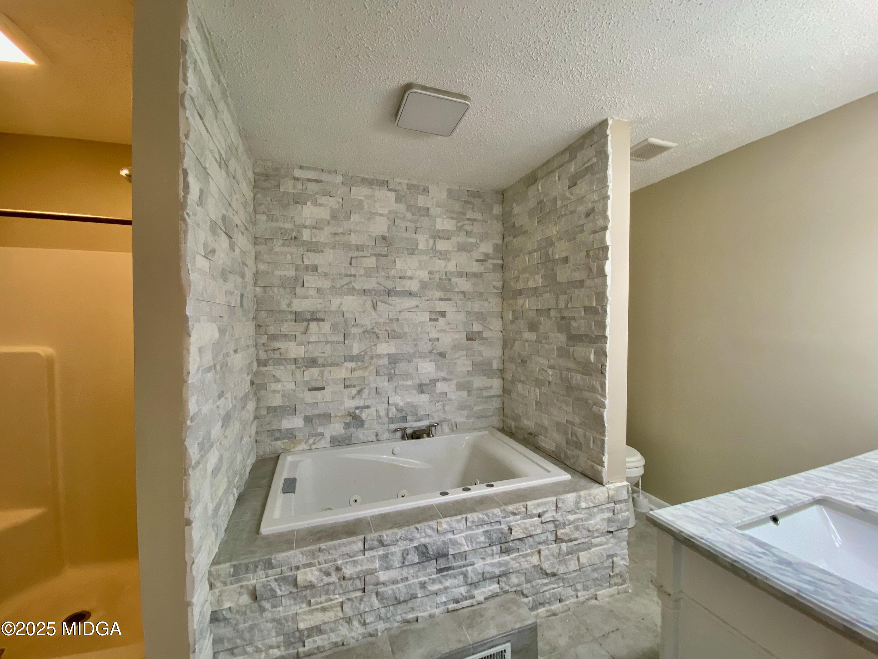 117 Laura Lane Fort Valley, GA 31030 - Photo 14 of 31 a bathroom with a bathtub and shower